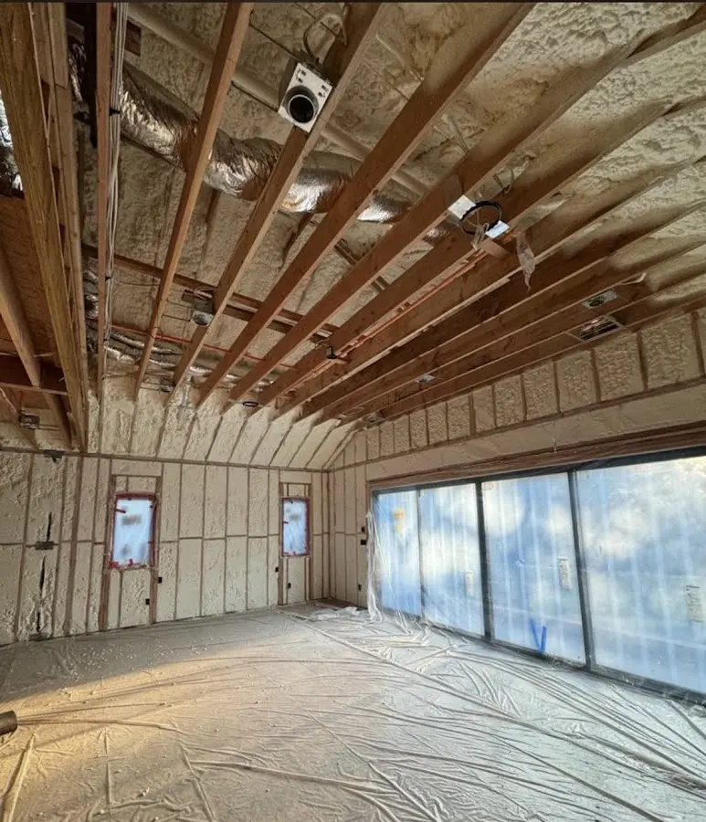 Interior walls and ceiling insulated with spray foam during new construction in Hoboken